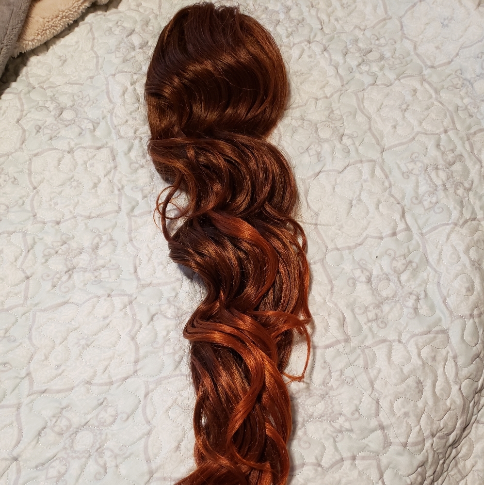 Brand new, never worn. Pony tail